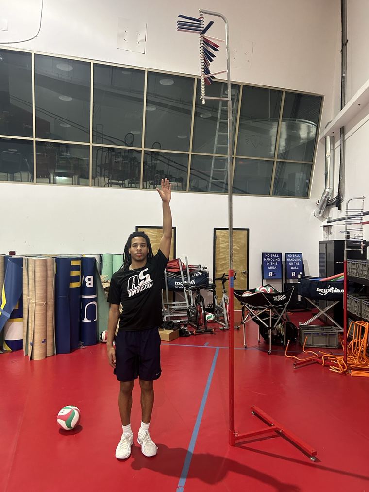 Jaxon Clark measuring his reach and vertical during training